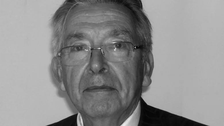 David Goldberg, an older man with grey hair and glasses, looking directly at the camera against a plain background.