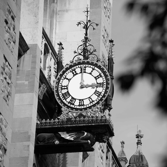 The beautiful clock that lives above the main entrance to the Maughan Library.