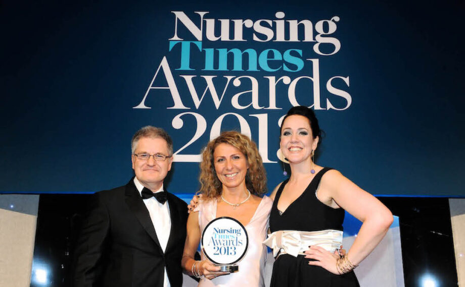 Group photo of a man and two women formally dressed and smiling at the 2013 Nursing Times Awards.
